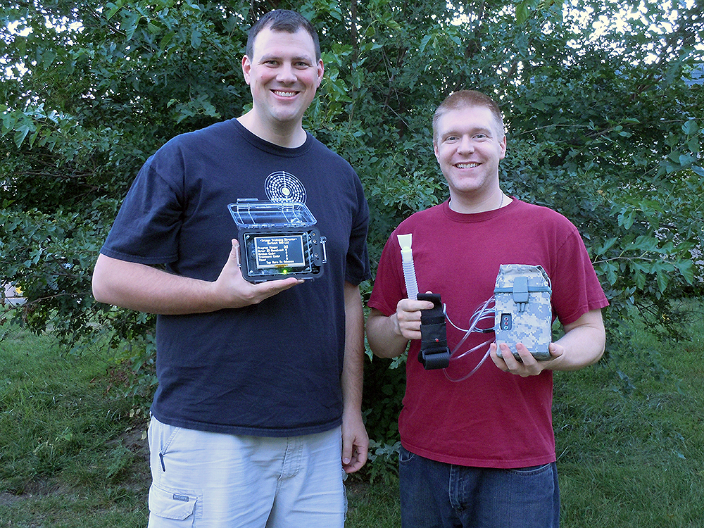 Triage Training System creator David Dorhout and friend Michah holding the "Acting Coach" and "Director's Tablet.".