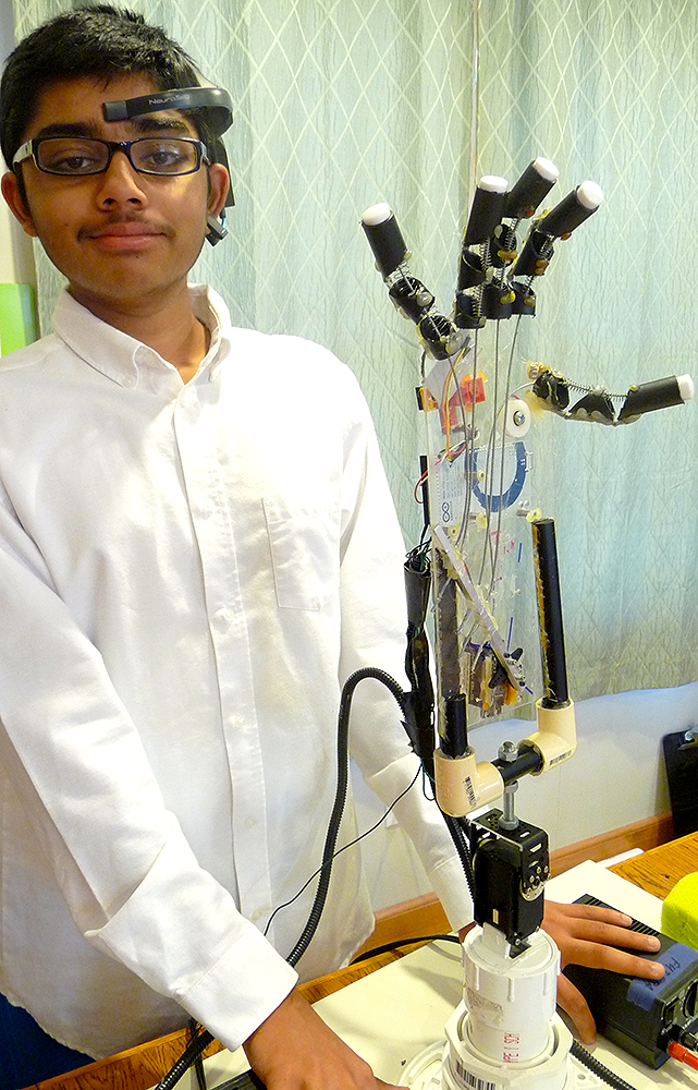 Shiva with his winning prosthetic hand project.